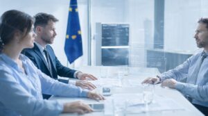 EU AI Act 2026 compliance: business team reviewing AI regulation requirements